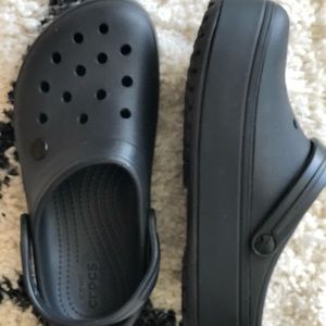 Crocs black slip ons. New. W8/M6. Never worn